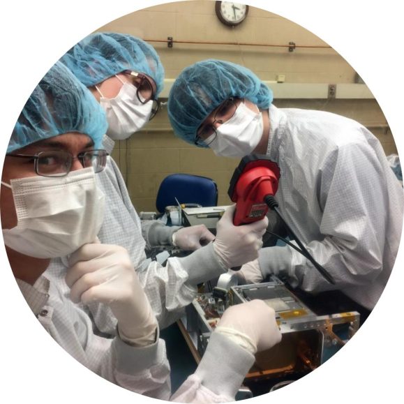 STAR Lab members working in scrubs, caps, and masks.